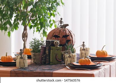 Halloween Table Setting With Squashes And Skeletons 