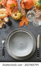 Halloween And Thanksgiving Day Table Setting With Gray Plate As Mockup.Festive Dinner Decoration Fallen Leaves, Pumpkins On Gray Linen Tablecloth. Top View. Vertical Format.