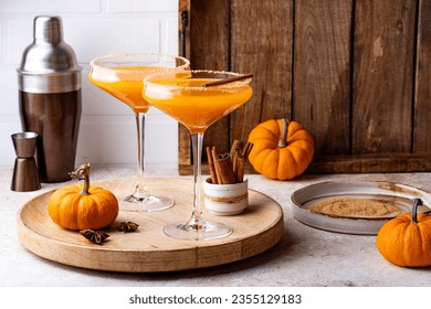 Halloween, Thanksgiving or fall cocktail pumpkin martini, homemade festive seasonal drink pumpkintini with cinnamon - Powered by Shutterstock