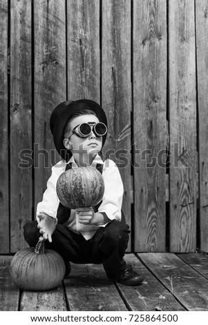 Similar – stylish little gentleman in hat looking up