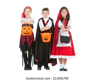 Halloween: Trick Or Treaters In Costume Hold Out Buckets For Candy