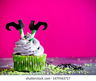 Halloween witch cupcakes decorated with cream and witch legs - Powered by Shutterstock