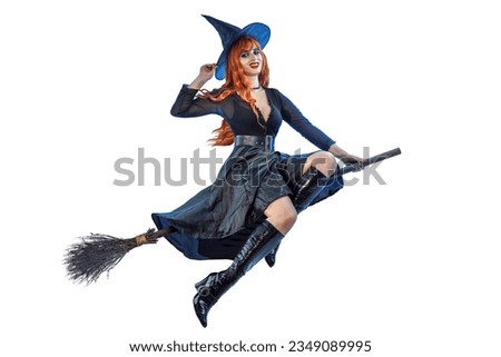 Halloween Witch flying on a broomstick. Female wizard fairy character for All Saints' Day. Fantasy gothic red-haired sorceress girl dressed in black carnival costume. Enchantress woman