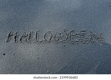 Halloween Writing On The Beach Sand