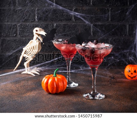 Halloweens spooky drink. Cocktail with blackberry