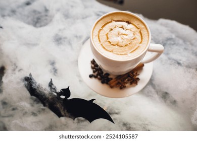 Halloween-Themed Coffee with Latte Art and Spices - Powered by Shutterstock