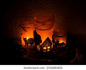 Halloween-themed jar lanterns with glowing black silhouettes - Powered by Shutterstock