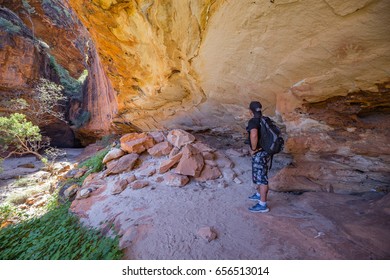 Halls Creek - May 15 2017: A Hiker Views An Australian Indigenous Art Gallery In Caves In The Bungle Bungle Massif That Are Normally Closed To The Public.