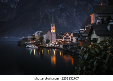 Hallstatt view at the evening. Nice image of famous austrian village surrounded by mountains and reflecions in the lake.