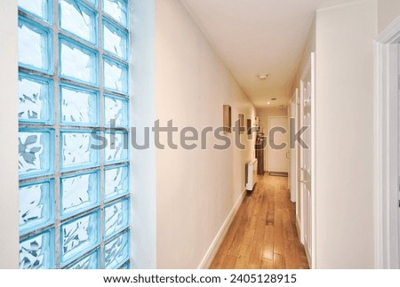 Hallway Decorated with Glss Brick Wall in a modern apartment in London UK