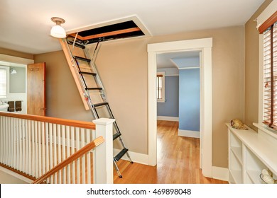 Hallway interior with folding attic ladder. Northwest, USA  - Powered by Shutterstock