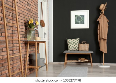 Hallway interior with stylish table and bench