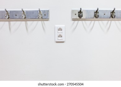 In The Hallway Of The School Hangs A Coat Rack On The Wall