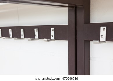 In The Hallway Of The School Hangs A Coat Rack On The Wall