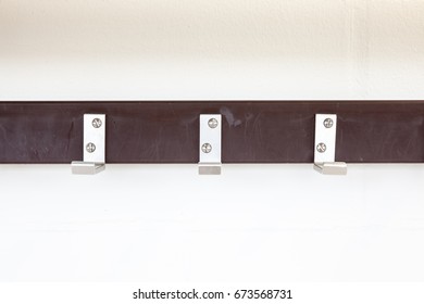 In The Hallway Of The School Hangs A Coat Rack On The Wall