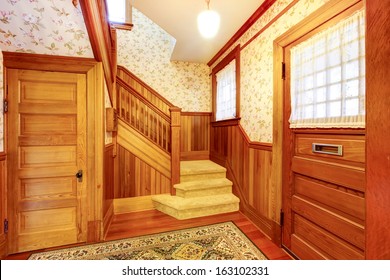 Hallway With Staircase And Two Doors. Old American Craftsman Style Home With Lots Of Wood Details.