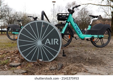 Halmstad, Halland, Sweden - March 01, 2022:  Image presents a air pumping statition to inflate bicycle wheels. Station is located close to the train station and big bicycle parking. 