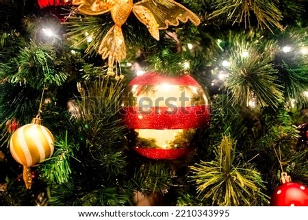 Halo of electtric lights and color balls decorating artificial Christmas tree Stock photo © 