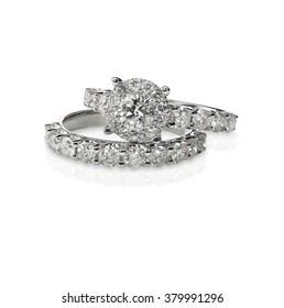 A Halo Setting Solitaire Set. Cluster Stack Of Diamond Wedding Engagement Rings Isolated On White