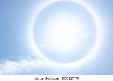 halo sun with blue sky from low angle  - Shutterstock ID 2030127470