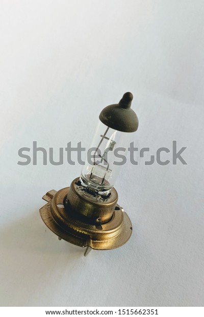 Halogen Auto Bulb. Isolated on\
white background. Car light bulb for use in illumination when\
moving.