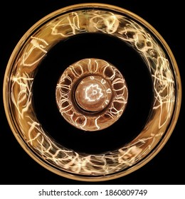 Halogen bulb, yeallow light at night, bottom view of fillament bulb, glowing bulb