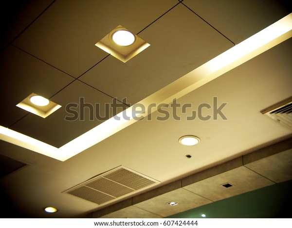 Halogen and LED bulbs ceiling lamps\
lighting with soft warm colour tone in a conference and studying\
room, selective focus for use as backdrop or\
background
