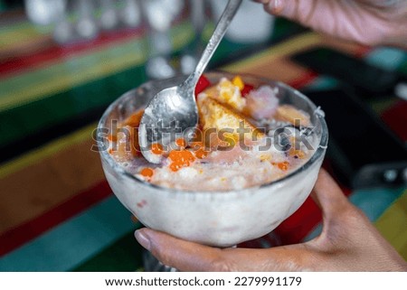 Halo-halo is a colorful Filipino beverage of crushed ice an mixtures of bean, jello, milk and many more.
