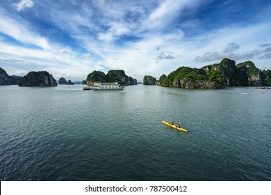 Halong Bay In Vietnam, UNESCO World Heritage Site, With Paddling Kayak.