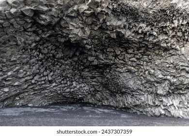 Halsanefshellir cave made of basalt columns on Reynisfjara Black sand beach, Iceland, inside view of the cave.