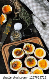 halved boiled eggs with shells. Stylish breakfast with eggs. Keto snack soft boiled eggs.