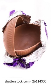 A Halved Milk Chocolate Easter Egg In Foil Wrapping