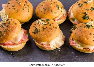 Ham And Cheese Sliders On Homemade Dinner Rolls.