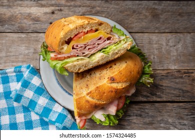 Ham And Cheese Sub Sandwich With Artisan Bread On Wooden Background