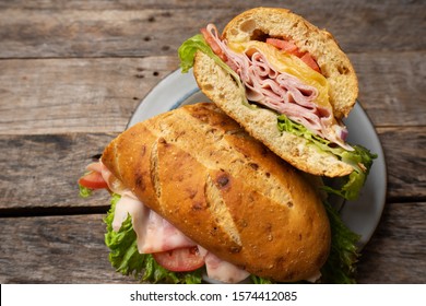 Ham And Cheese Sub Sandwich With Artisan Bread On Wooden Background
