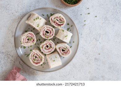 Ham and cream cheese rolled up in a flour tortilla - Powered by Shutterstock