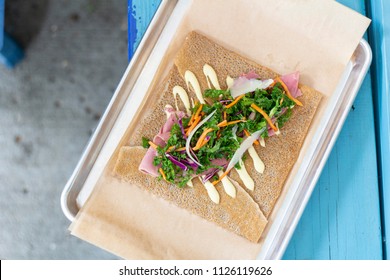 Ham Crepe With Green Slaw Reuben With Kale Vegetables Cafe Setting