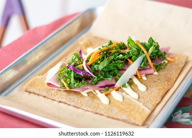 Ham Crepe With Green Slaw Reuben With Kale Vegetables Cafe Setting