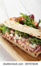 ham hock flat bread sandwich with salad