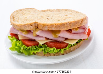 Ham, Lettuce, Cheese And Mustard Sandwich On Whole Wheat Bread