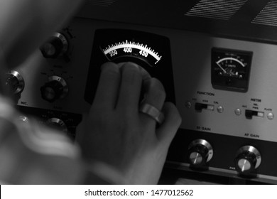 A Ham Radio Operator Tuning His Equipment.