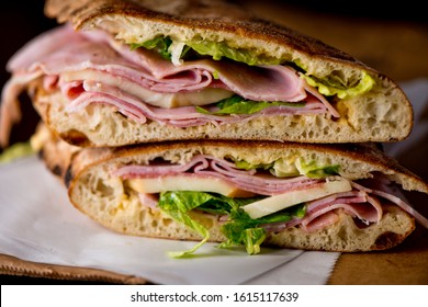 Ham Sandwich. Country Ham And Swiss Cheese. Classic Delicatessen Sandwich. Whole Ham, Carved With A Butchers Knife. Lunch Or Dinner Favorite, Meat Ideal For Sandwiches Or Served With Vegetables.