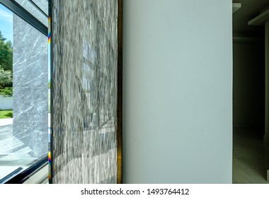 HAMALA, BAHRAIN - MARCH 02, 2019: Detail of a glass mirror frame in an interior view of the entrance of a luxury Middle Eastern villa development. - Shutterstock ID 1493764412