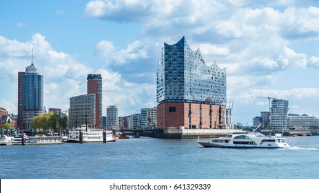 Hamburg, elbphilharmonie and modern buildings with boat to the harbor tour