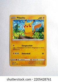 Hamburg, Germany - 09232022: Top Shot Photo Of The German Pokemon Pikachu MCD227 McDonalds Holo Card On White Paper Background.