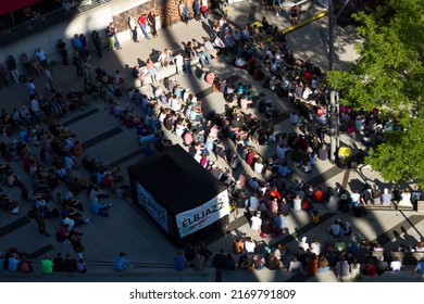 Hamburg, Germany 12.6.2022 Group Of People Sitting At Outdoor Music Festival. Aerial Top Down View Of People In Outdoor Festival.