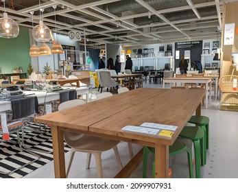 Hamburg, Germany 13.12.21 Kitchen Tables And Dining Room Furniture For Sale In Large Furniture Store. Interior Of Ikea Store With Cheap Wooden Kitchen Tables And Kitchen Decor Acessories