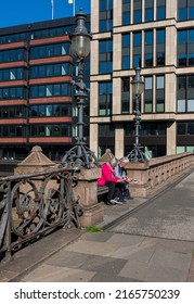 Hamburg, Germany, 2022, April, 04, Senior Couple Sitting On A Bench At The High Bridge, Hamburg