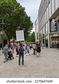 Hamburg, Germany 2.6.2022 Religious Christian Holding A Sign On The Street. Jehovahś Witness Preaching His Religion And Trying To Convert People On The Street