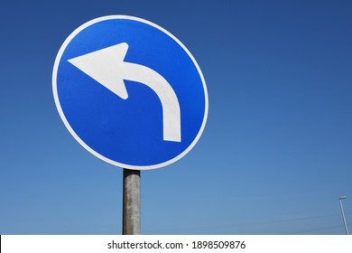 Hamburg, Germany - April 5, 2020: German road sign: turn left - symbol for political orientation